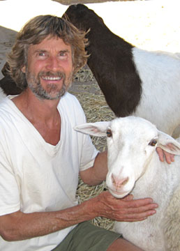 Dr. Will Tuttle with rescued sheep from animal Sanctuary